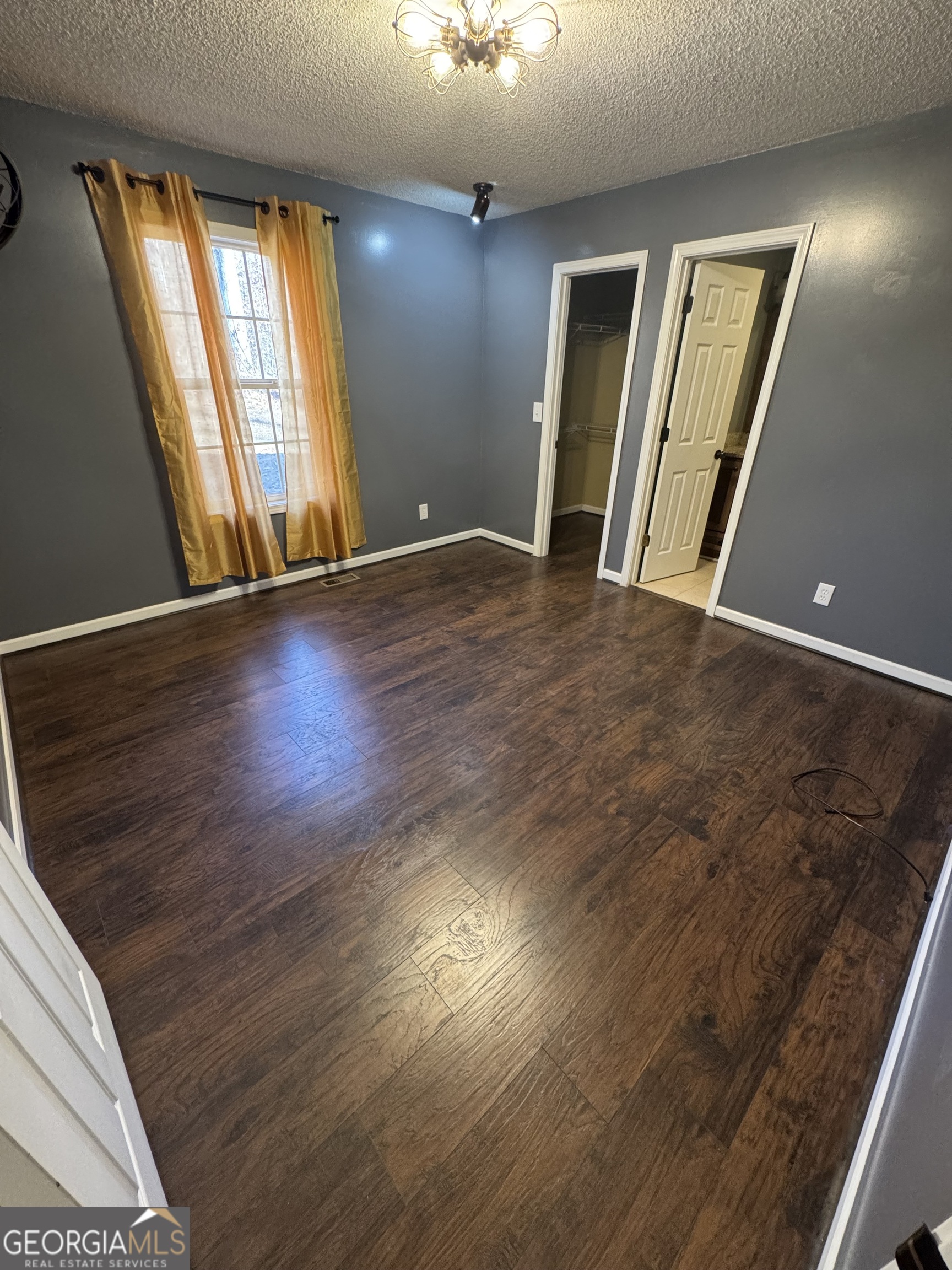 813 Normandy Trail Lavonia, GA 30553 - Photo 11 of 32 wooden floor and windows in a room