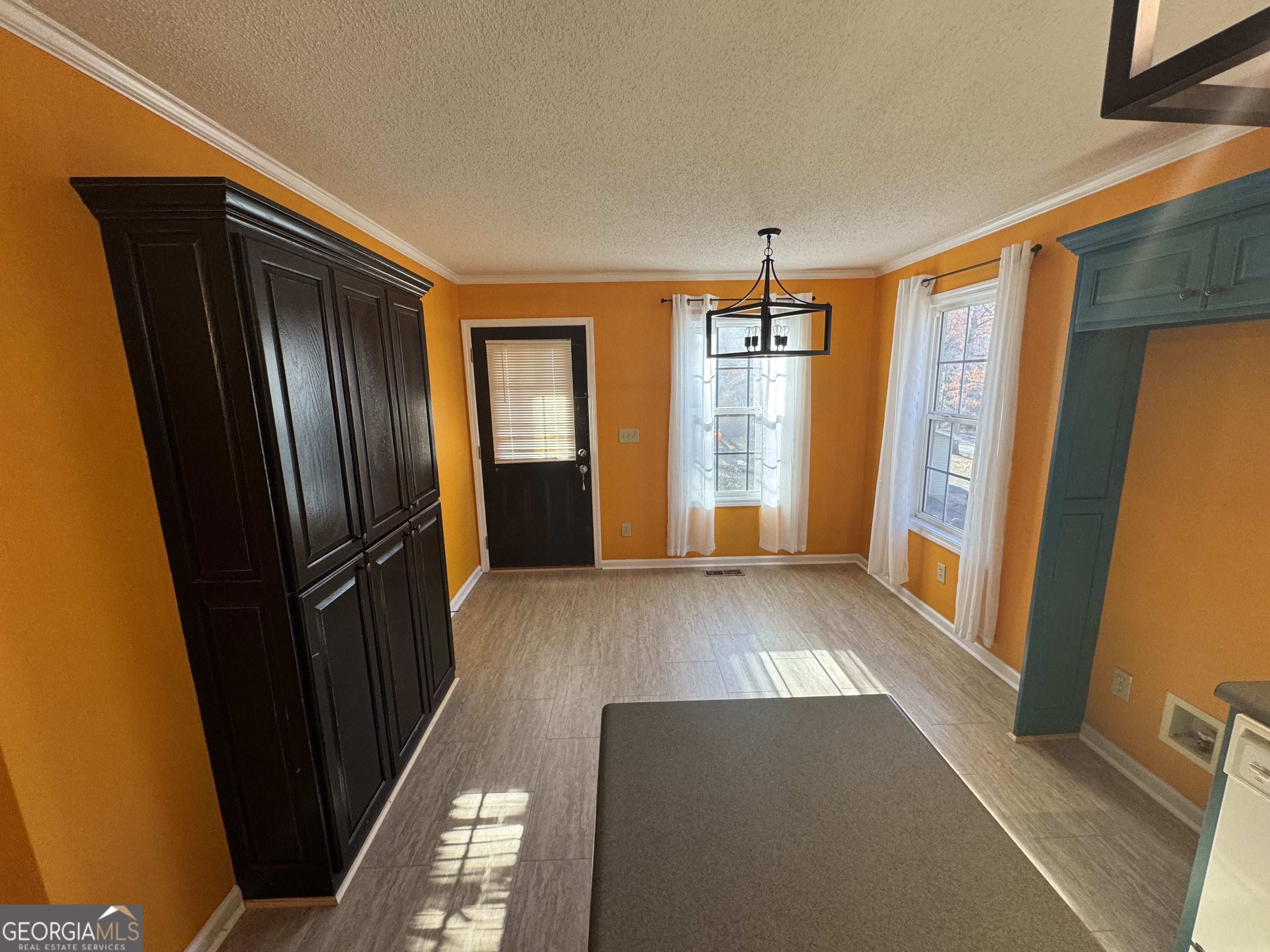 813 Normandy Trail Lavonia, GA 30553 - Photo 15 of 32 a view of entryway with stairs and wooden floor