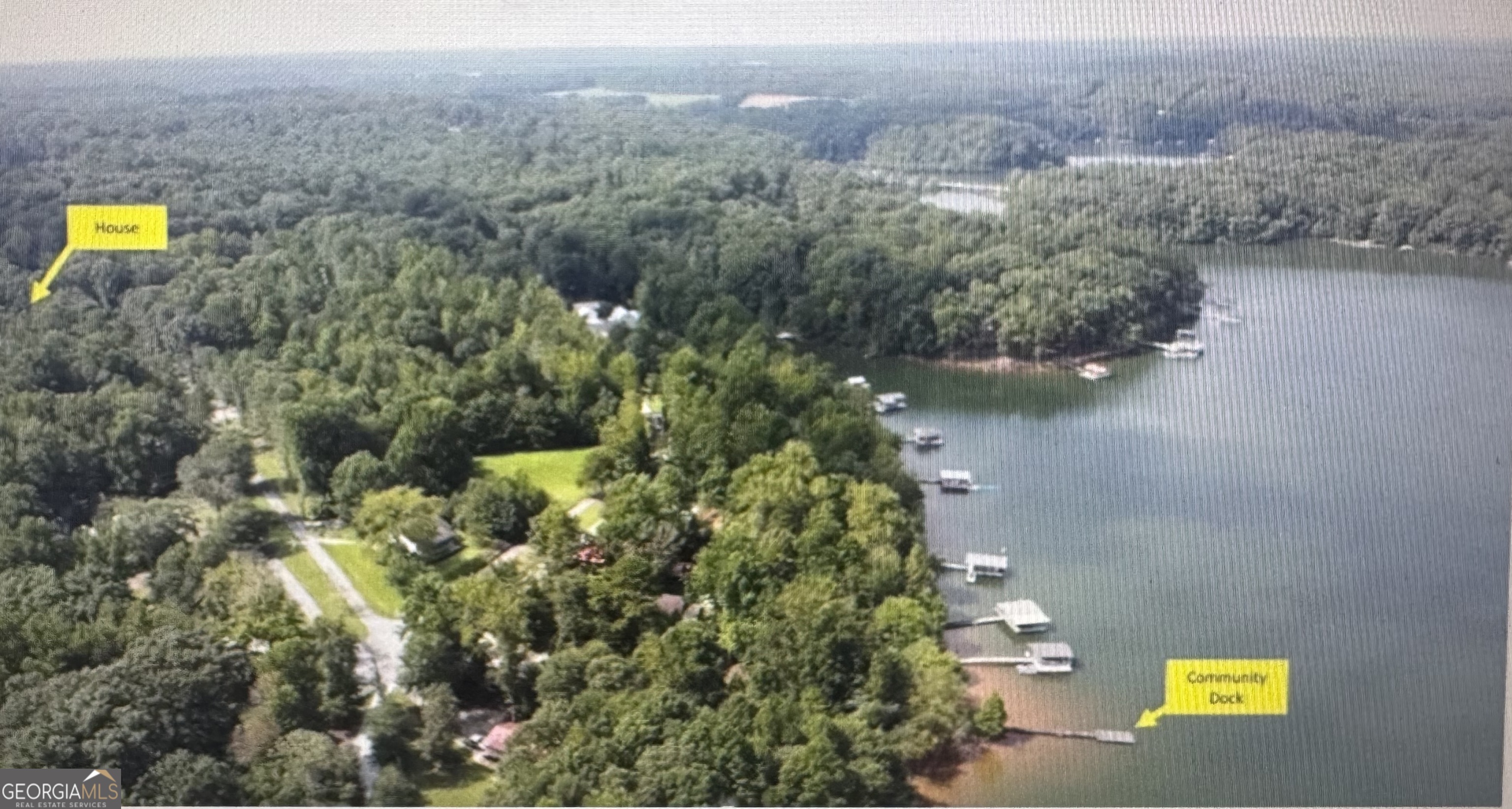 813 Normandy Trail Lavonia, GA 30553 - Photo 25 of 32 an aerial view of a houses with a lake view