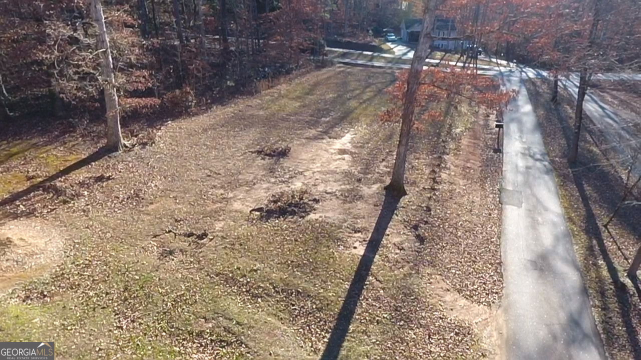813 Normandy Trail Lavonia, GA 30553 - Photo 9 of 32 a view of a yard with wooden fence