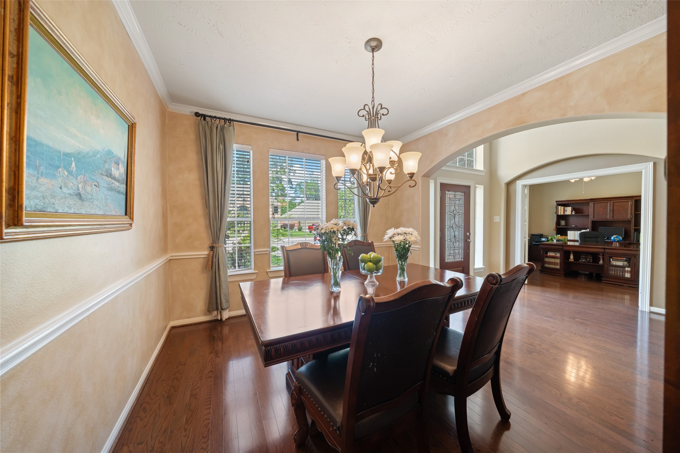 6407 Ashley Manor Drive Spring, TX 77389 - Photo 5 of 41 a view of a dining room with furniture a chandelier and wooden floor
