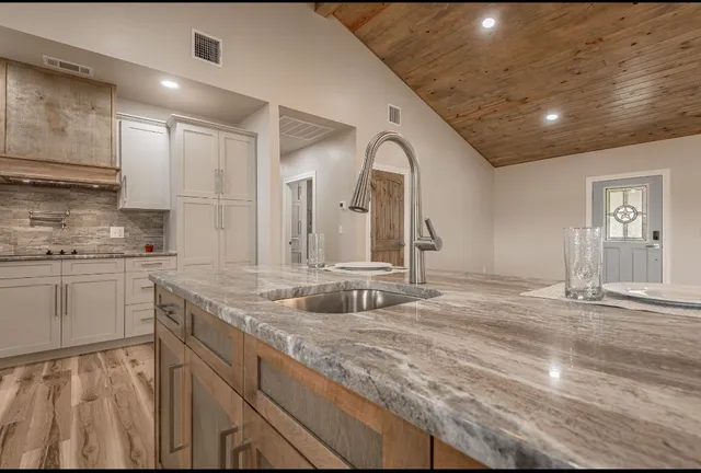 a bathroom with sink and mirror