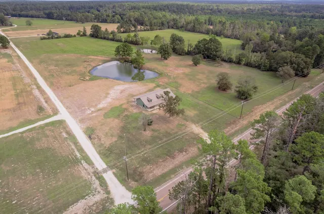 an aerial view of a houses with outdoor space