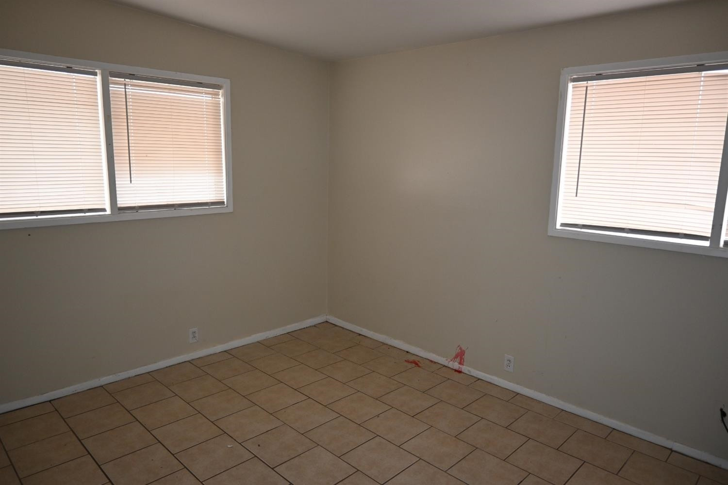 2725 62nd Street Lubbock, TX 79413 - Photo 5 of 11 an empty room with a window