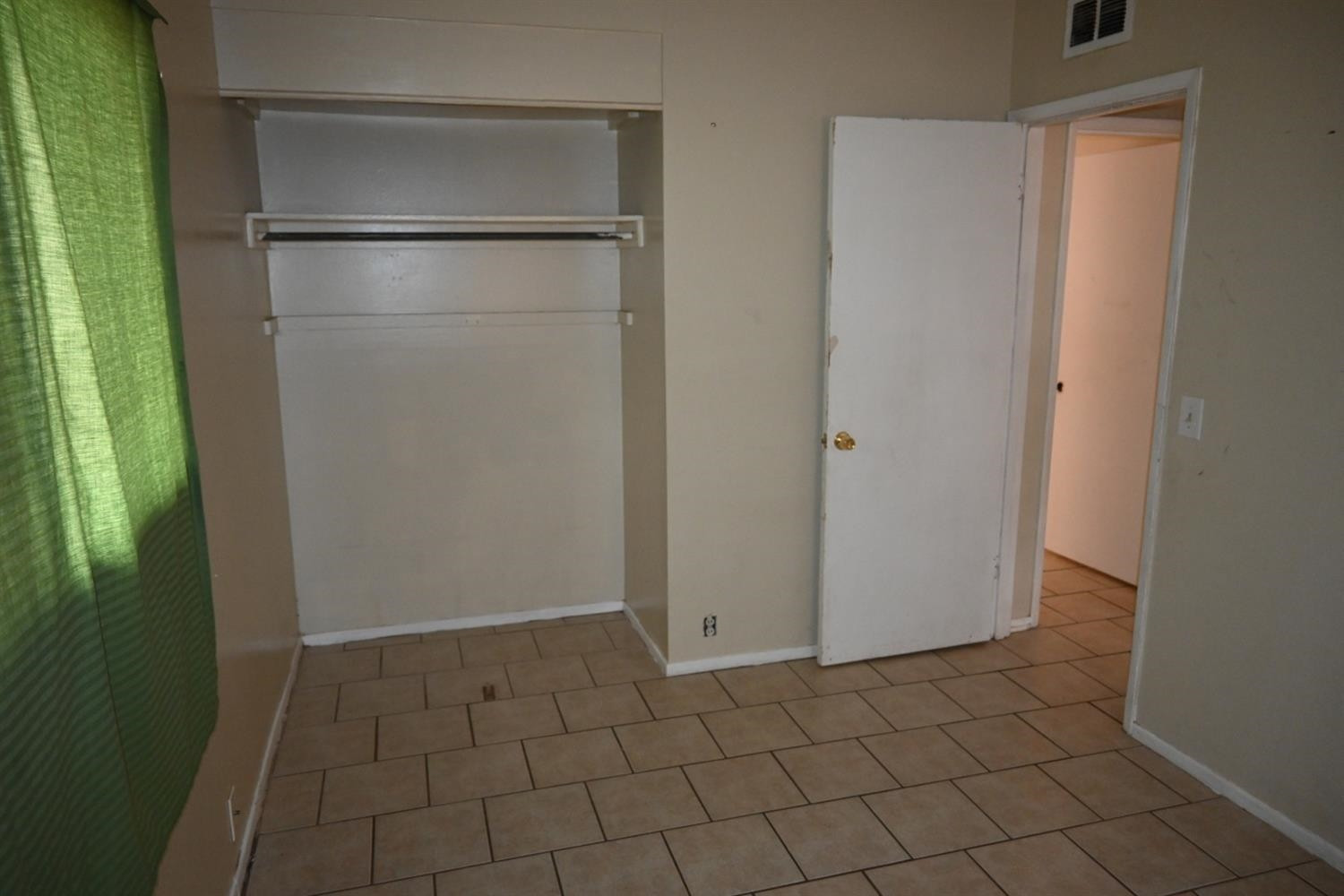 2725 62nd Street Lubbock, TX 79413 - Photo 9 of 11 a view of a closet area with an empty room