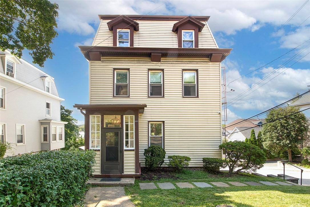a front view of a house with a yard