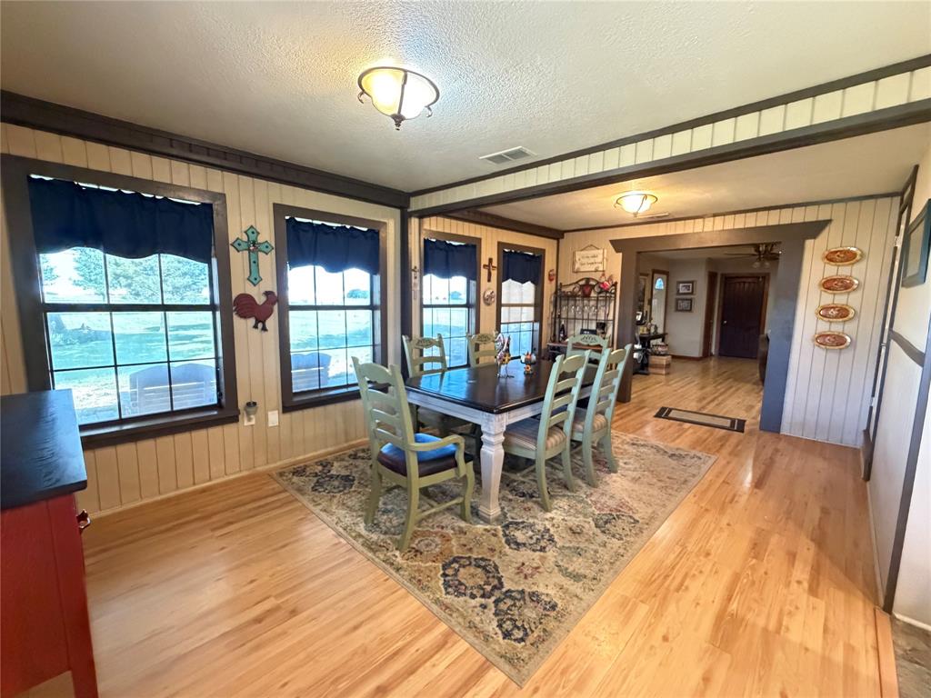 330 South Goode Road Wilmer, TX 75172 - Photo 14 of 38 a dining room with furniture and wooden floor