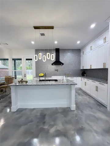 a living room with granite countertop furniture and a fireplace