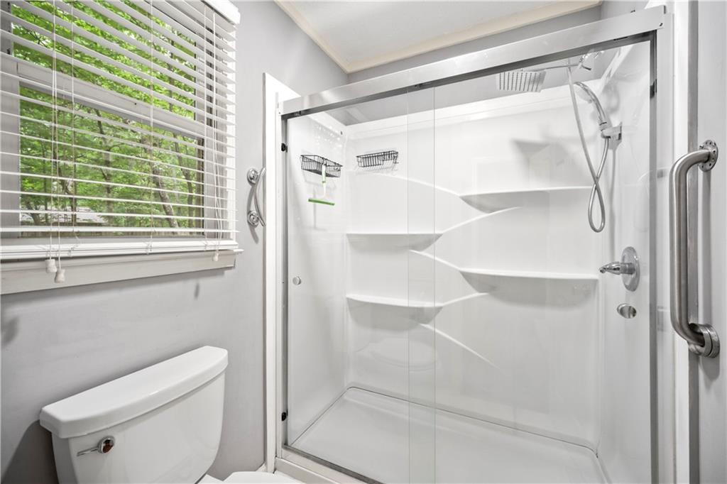 2009 Ben Higgins Road Dahlonega, GA 30533 - Photo 14 of 25 a bathroom with a shower and toilet