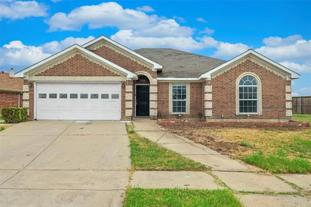 a view of house with yard