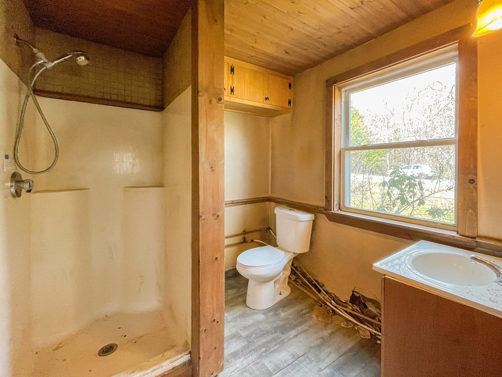 1430 Old Rte 9 Windsor, MA 01270 - Photo 12 of 14 a bathroom with a granite countertop sink toilet and shower