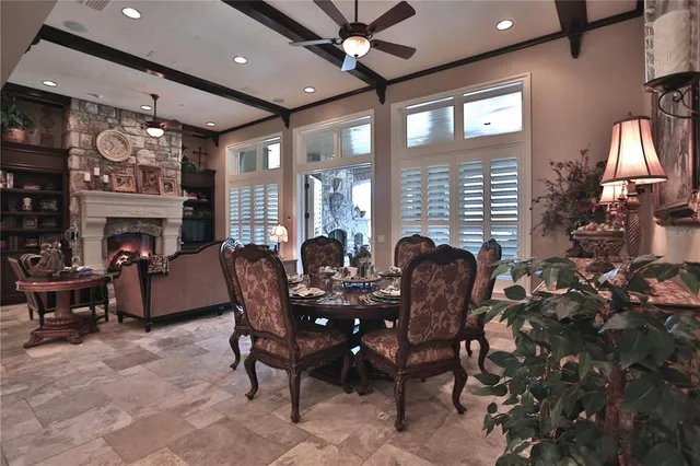 a kitchen with cabinets and chairs