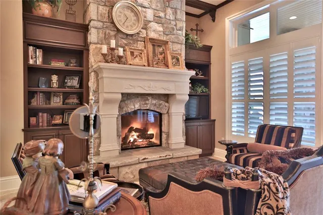 a very nice looking dining room with furniture a chandelier and kitchen view