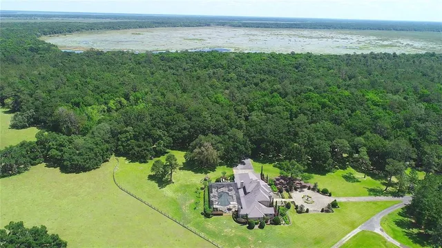 a view of a lake with a yard