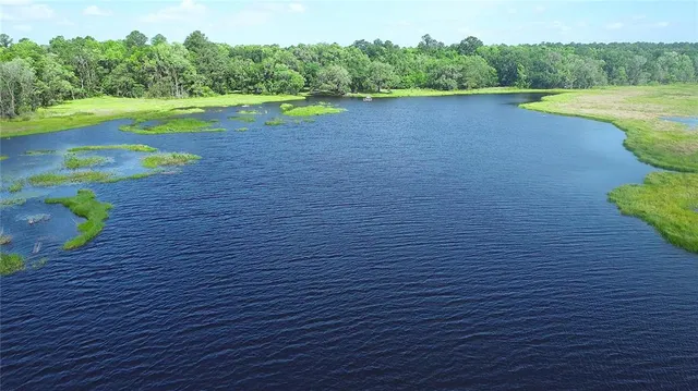 a view of a lake view with a big yard