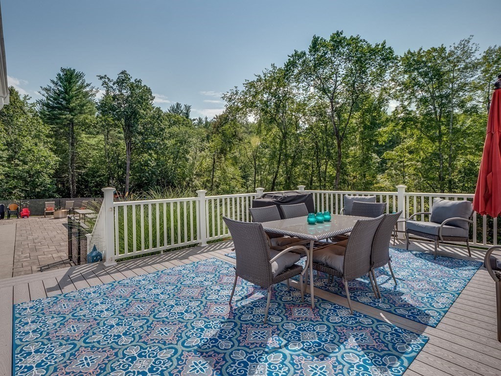 75 A Hazen Road Shirley, MA 01464 - Photo 28 of 42 a view of a dinning table and chairs on the deck