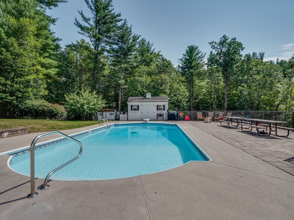 75 A Hazen Road Shirley, MA 01464 - Photo 30 of 42 a view of a swimming pool with a lounge chair