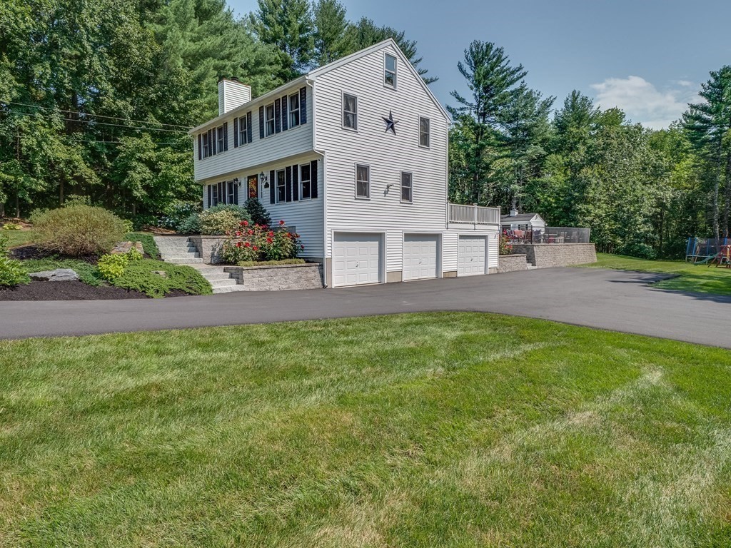 75 A Hazen Road Shirley, MA 01464 - Photo 35 of 42 a view of a big house with a big yard and large trees