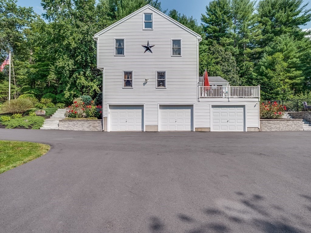 75 A Hazen Road Shirley, MA 01464 - Photo 36 of 42 a view of a house with a yard and garage