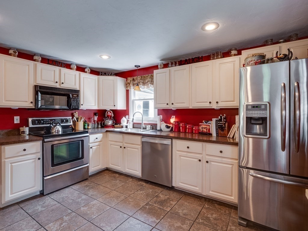 75 A Hazen Road Shirley, MA 01464 - Photo 4 of 42 a kitchen with granite countertop a refrigerator sink and microwave