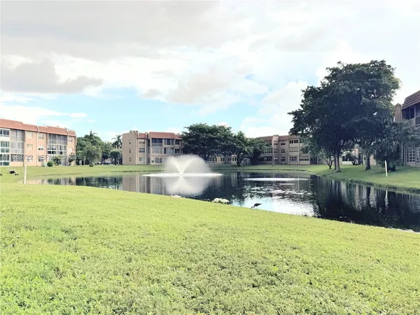 a view of swimming pool with outdoor seating space