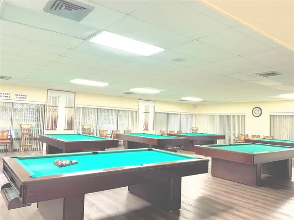 a view of an ocean with a house in the background