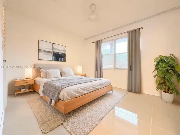 a bedroom with a bed and a couch