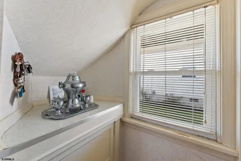 a view of a sink and a window