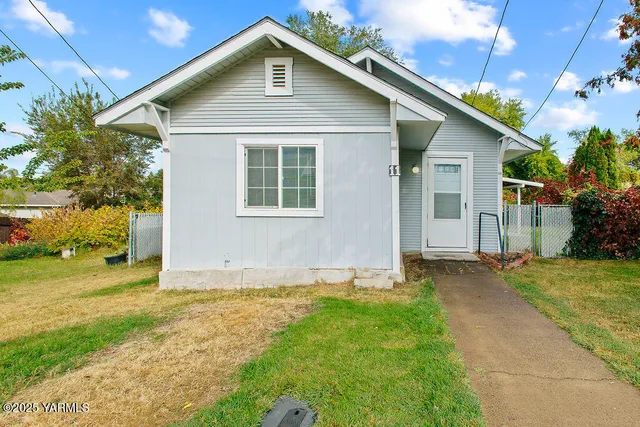 a house with trees in the background