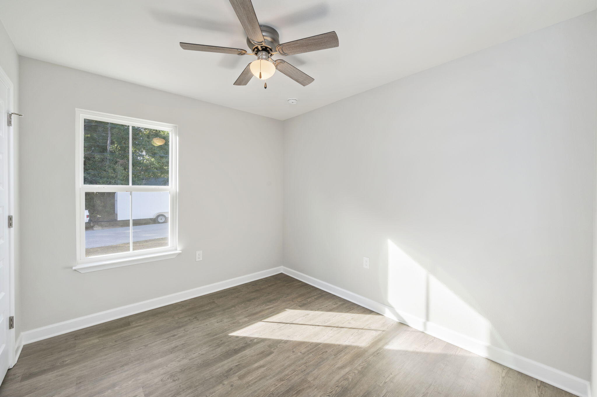 1000 Valley Road Crestview, FL 32539 - Photo 14 of 30 an empty room with a window and a ceiling fan