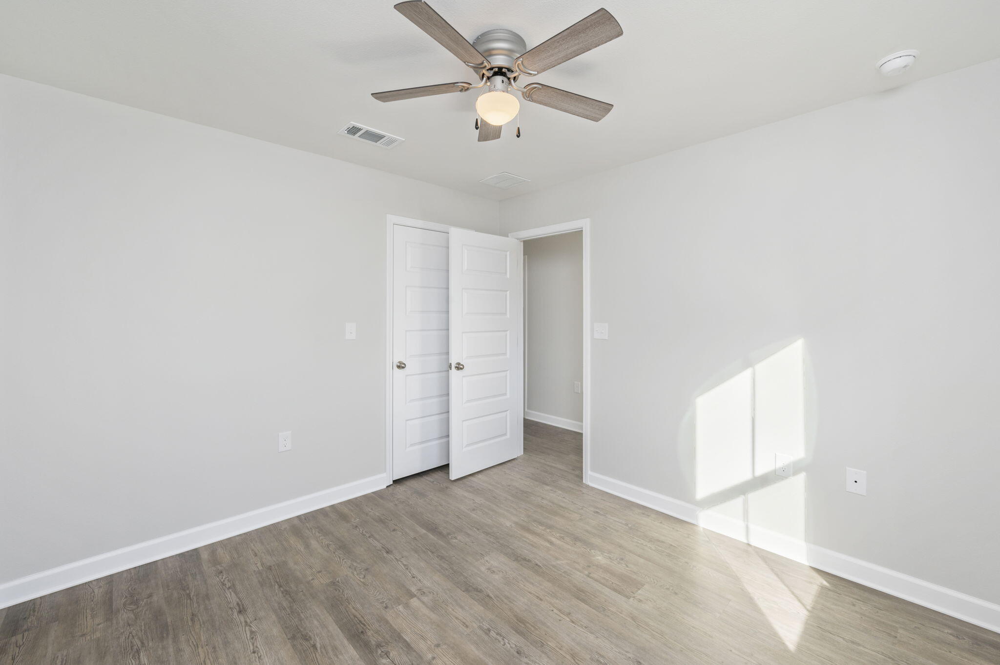 1000 Valley Road Crestview, FL 32539 - Photo 17 of 30 an empty room with a window and a ceiling fan