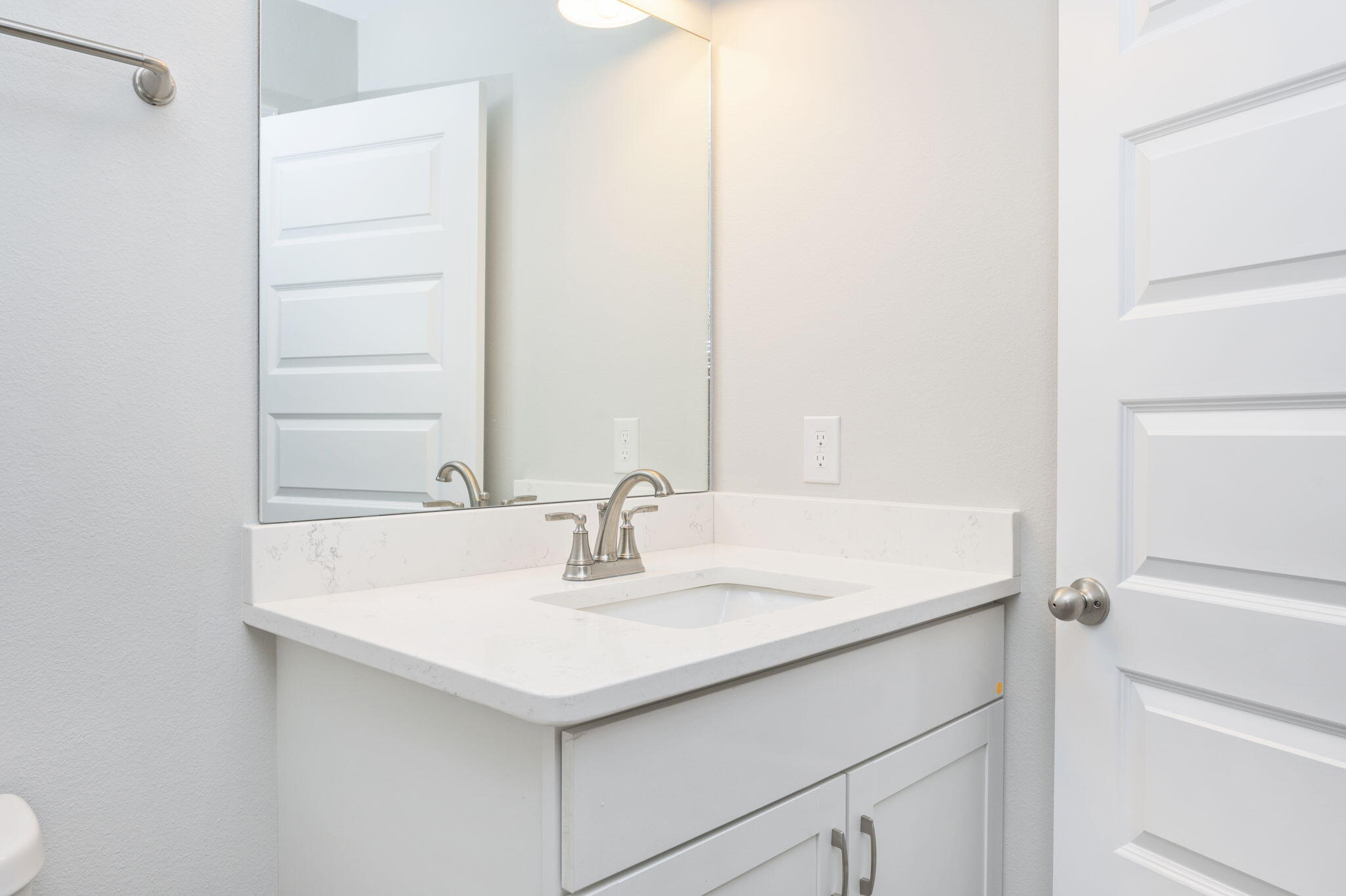 1000 Valley Road Crestview, FL 32539 - Photo 18 of 30 a bathroom with a sink and a mirror