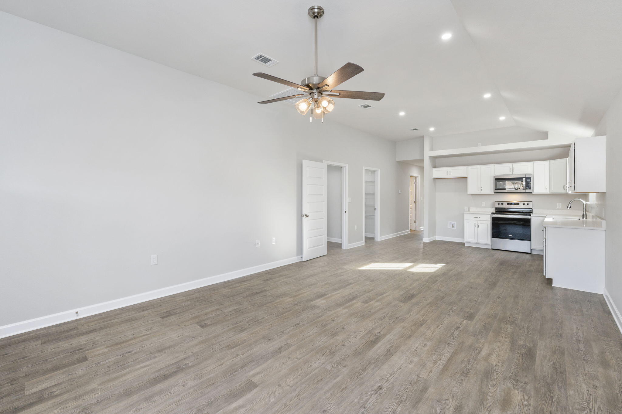 1000 Valley Road Crestview, FL 32539 - Photo 7 of 30 a view of a kitchen with a sink and a stove top oven