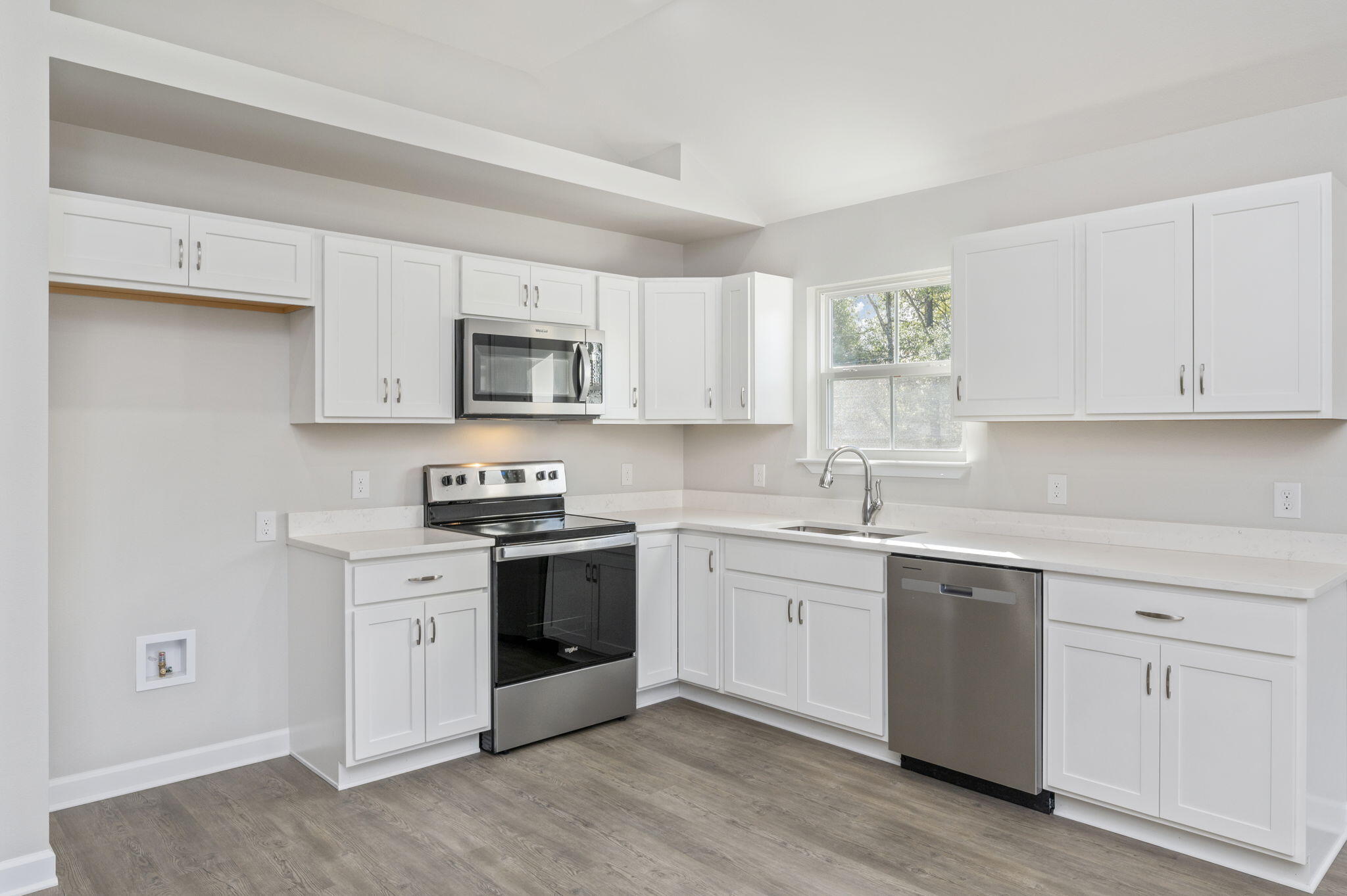 1000 Valley Road Crestview, FL 32539 - Photo 9 of 30 a kitchen with white cabinets stainless steel appliances and sink