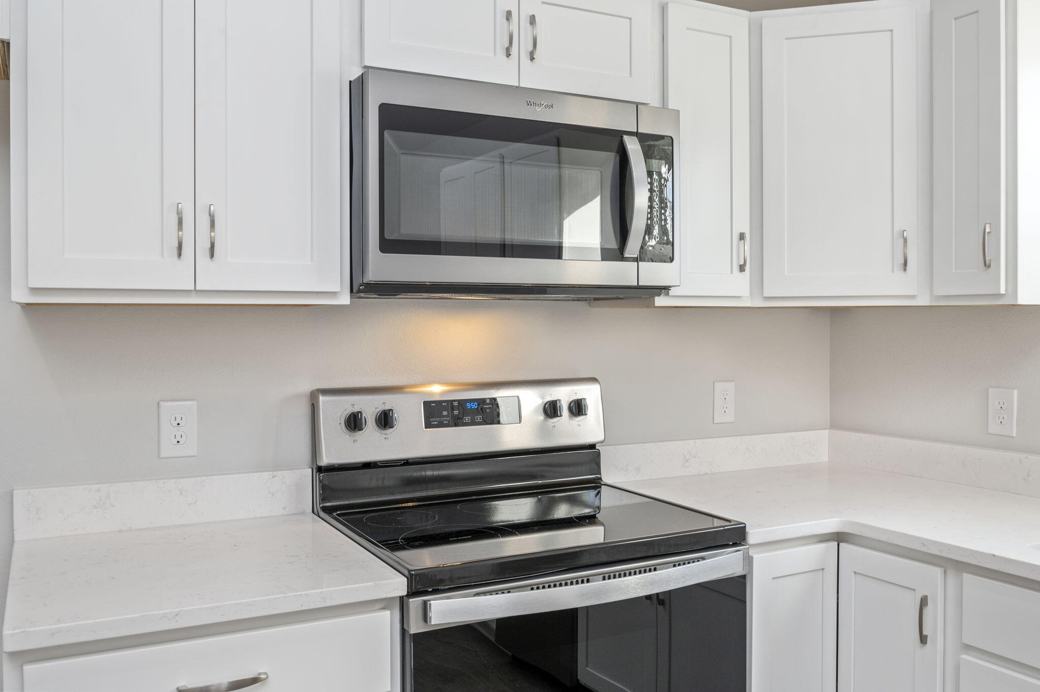 1000 Valley Road Crestview, FL 32539 - Photo 10 of 30 a kitchen with wooden cabinets and a stove top oven