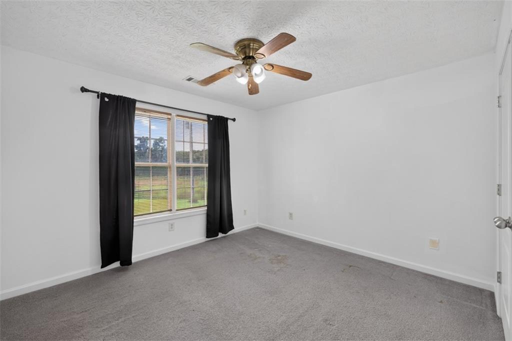 602 Pendergrass Road Winder, GA 30680 - Photo 28 of 44 a view of an empty room with a window