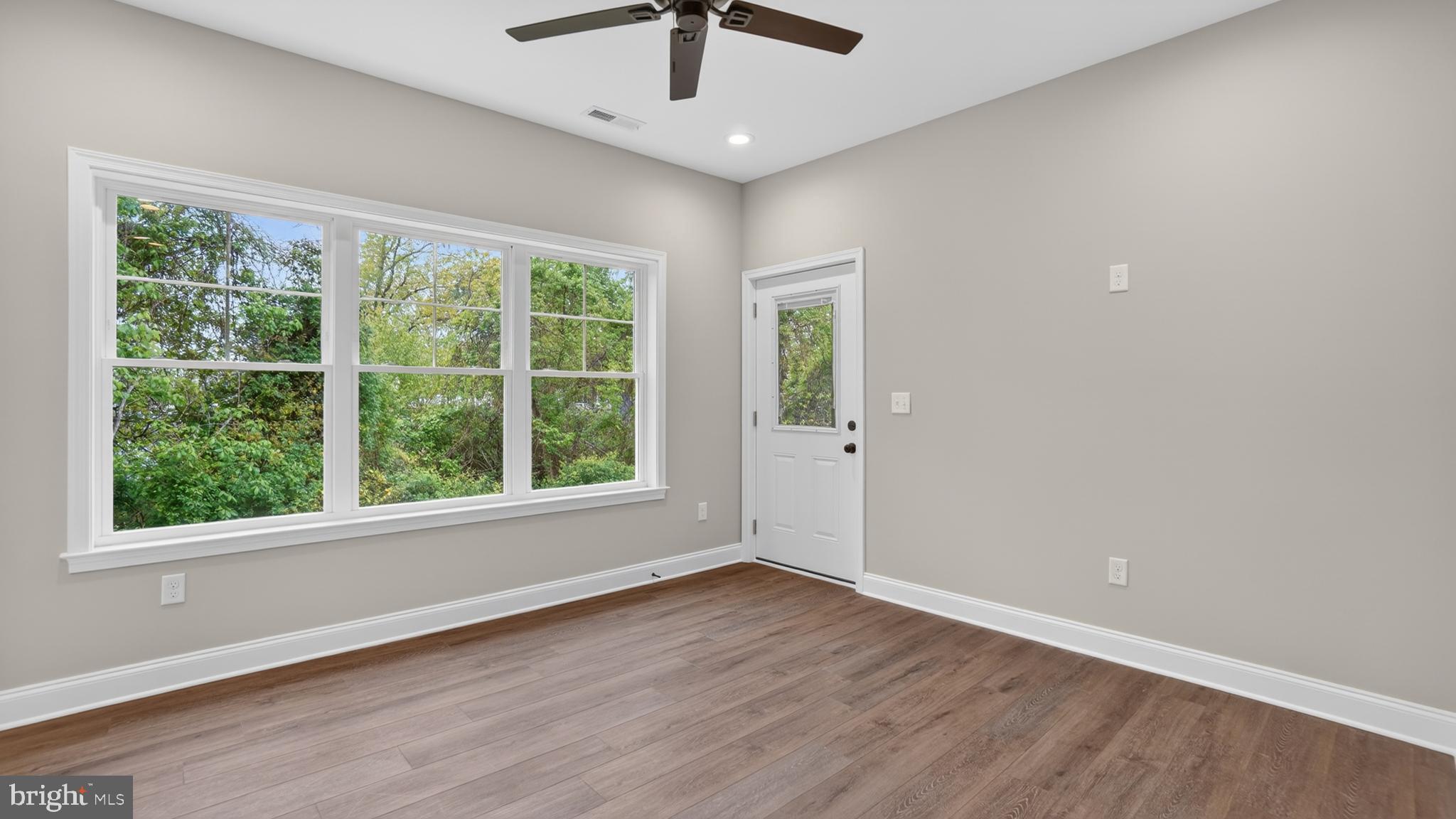 2001 Poplar Ridge Road Pasadena, MD 21122 - Photo 28 of 83 wooden floor in an empty room with a window