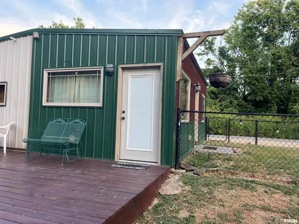a view of a house with a yard and a garden