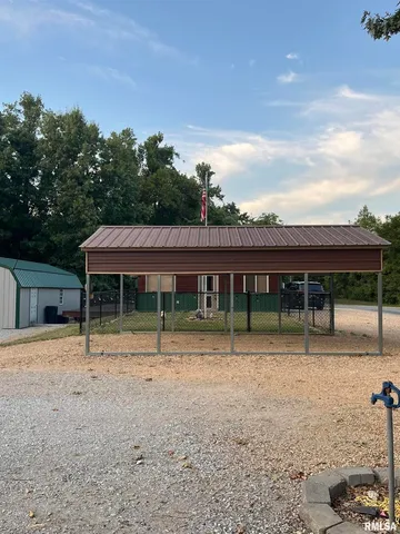 a house with trees in the background