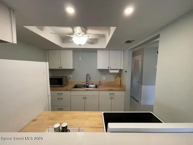 a bed sitting in a room next to a window