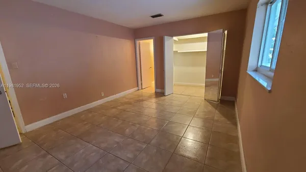 a view of an empty room and window