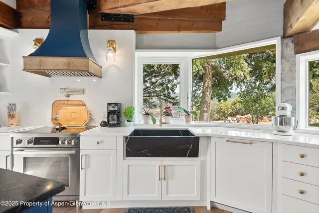 a kitchen with a stove and a sink