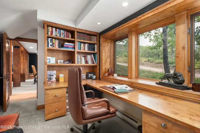 a room with furniture cabinets and window