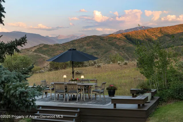 a view of house with backyard and patio