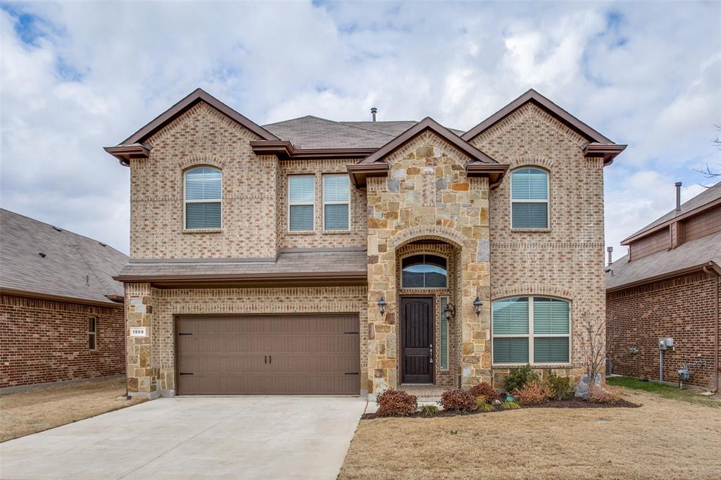 a front view of a house with yard