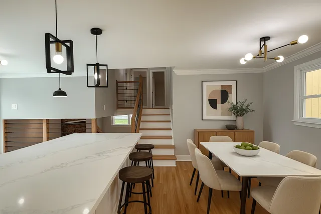 a kitchen with a table chairs and entryway