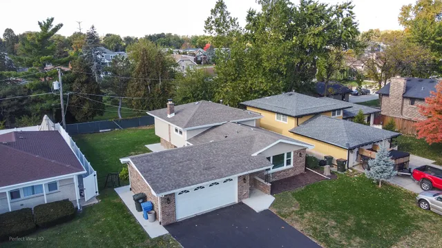 a aerial view of a house with a yard