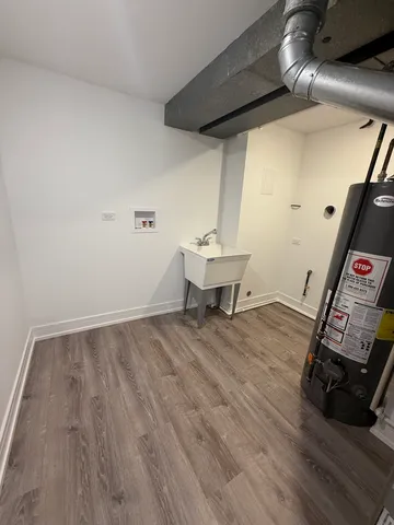 a view of a room with wooden floor