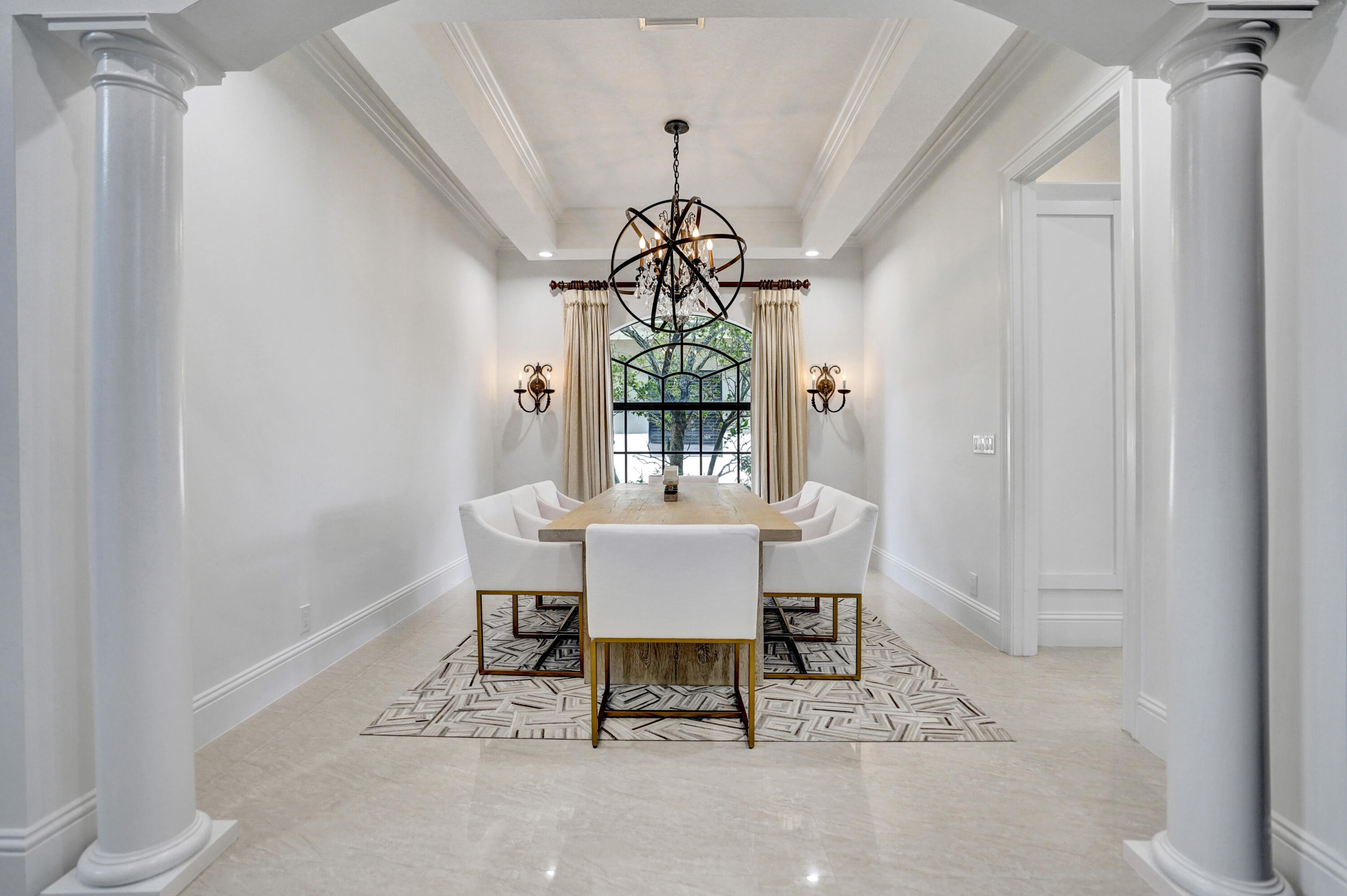 9210 Equus Circle Boynton Beach, FL 33472 - Photo 11 of 75 a dining room with a window and a chandelier