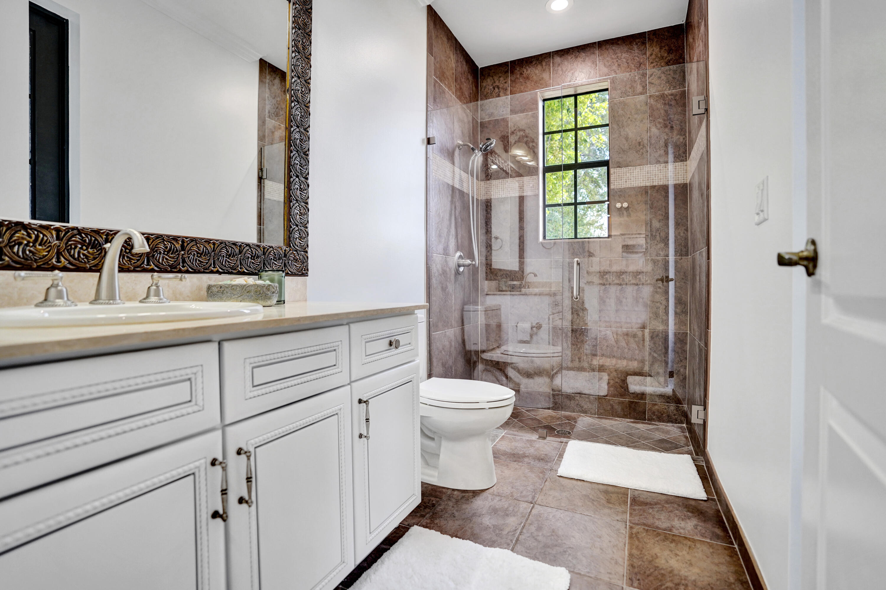 9210 Equus Circle Boynton Beach, FL 33472 - Photo 17 of 75 a bathroom with a sink a toilet and shower